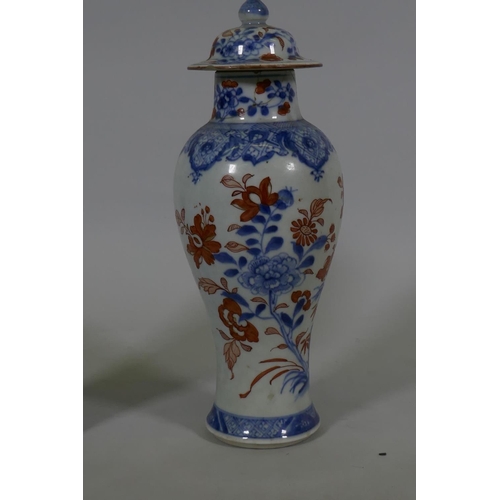 7 - A Pair of C19th Chinese Imari pattern vases with covers, AF chips, racks and repairs, 28cm high