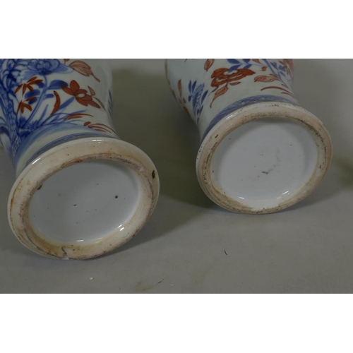 7 - A Pair of C19th Chinese Imari pattern vases with covers, AF chips, racks and repairs, 28cm high