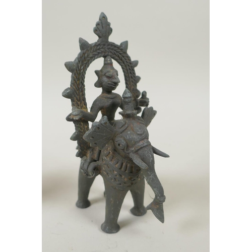 70 - Three antique Indian bronze figures, two riding on a horse and elephant, 13cm high