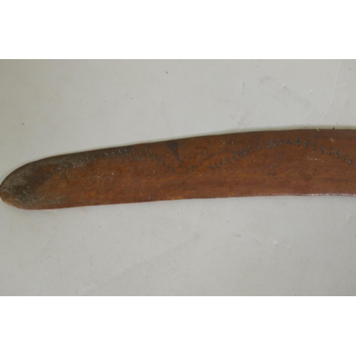 74 - An antique hardwood boomerang, 52cm wide