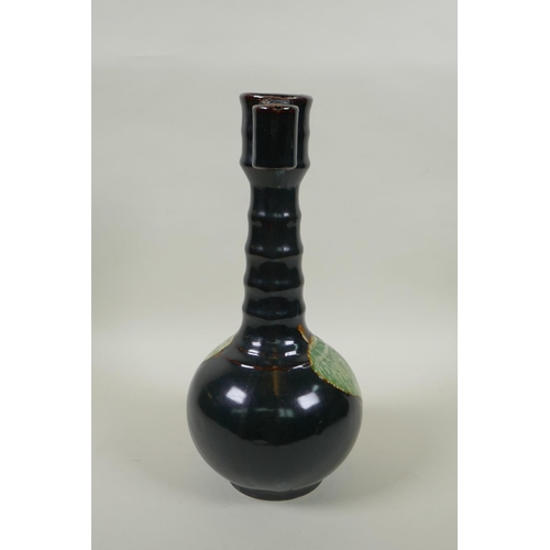 75 - A Chinese Jian ware bottle vase with ribbed neck, two lug handles and decorated with a leaf skeleton... 