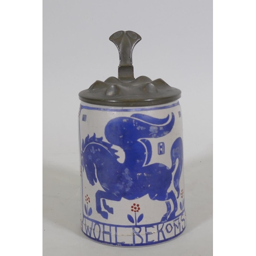 76 - A German ceramic Stein with pewter lid, designed by Ludwig Holwein, No. 65 from a set of 12 decorate... 