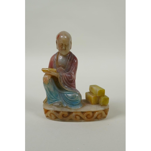 78 - A Chinese carved and dyed soapstone figure of Lohan, on a display stand, AF repair, 13cm high