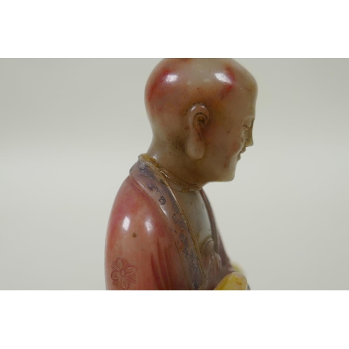 78 - A Chinese carved and dyed soapstone figure of Lohan, on a display stand, AF repair, 13cm high