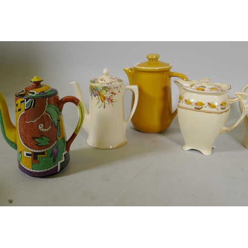 79 - A collection of Staffordshire pottery tea and coffee pots, various makes, Doulton 'Lynn', Royal Wint... 