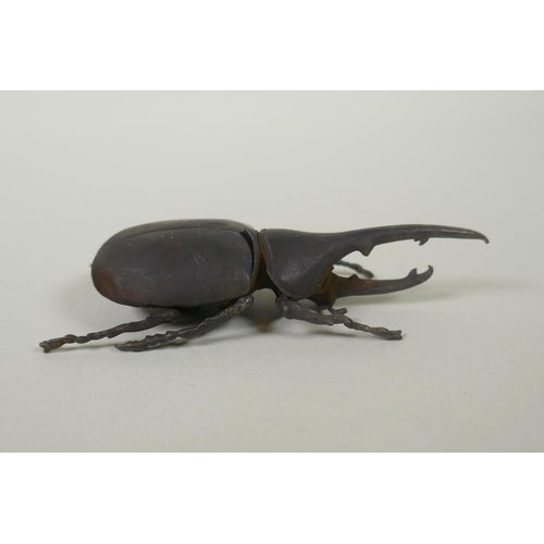 80 - A Japanese style bronze okimono rhinoceros beetle, 10cm