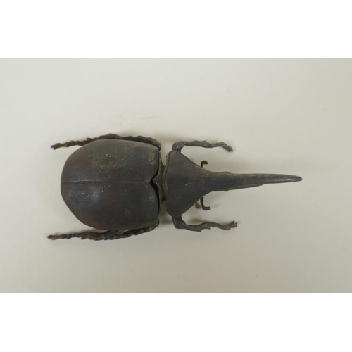 80 - A Japanese style bronze okimono rhinoceros beetle, 10cm