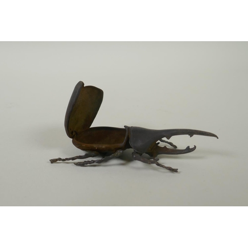 80 - A Japanese style bronze okimono rhinoceros beetle, 10cm