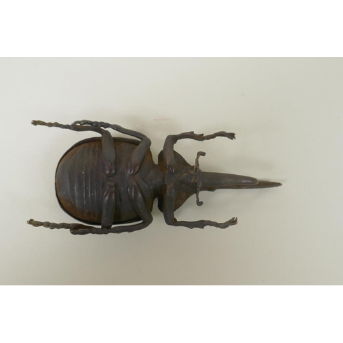 80 - A Japanese style bronze okimono rhinoceros beetle, 10cm