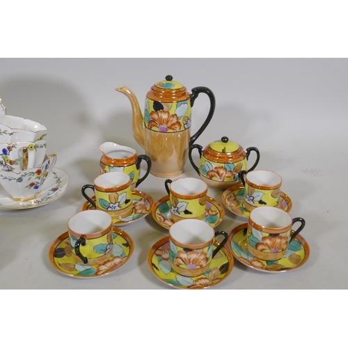 82 - A vintage Bohemian 12 place porcelain tea set with floral decoration, sandwich plate 23cm diameter, ... 