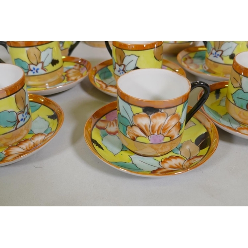 82 - A vintage Bohemian 12 place porcelain tea set with floral decoration, sandwich plate 23cm diameter, ... 