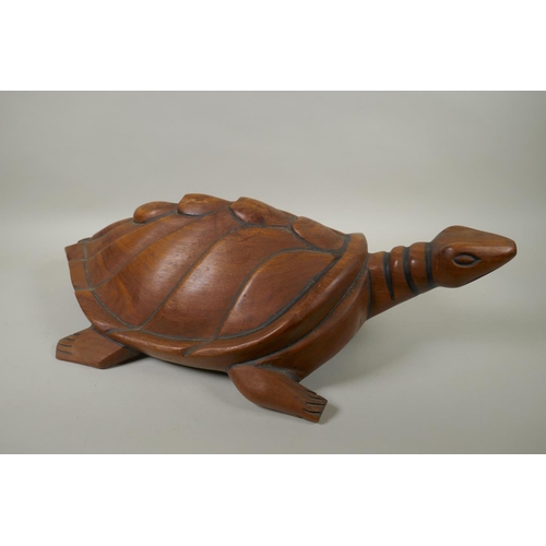 86 - A Pacific islanders carved hardwood figure of a turtle, 60cm long