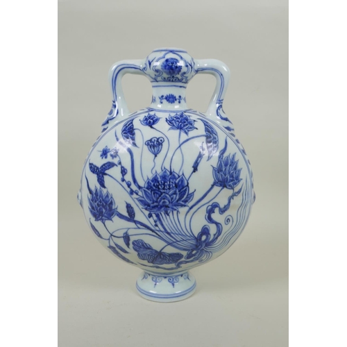 91 - A Chinese blue and white two handled moon flask with lotus flower decoration, 28cm high