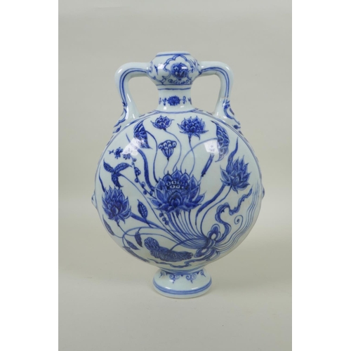 91 - A Chinese blue and white two handled moon flask with lotus flower decoration, 28cm high