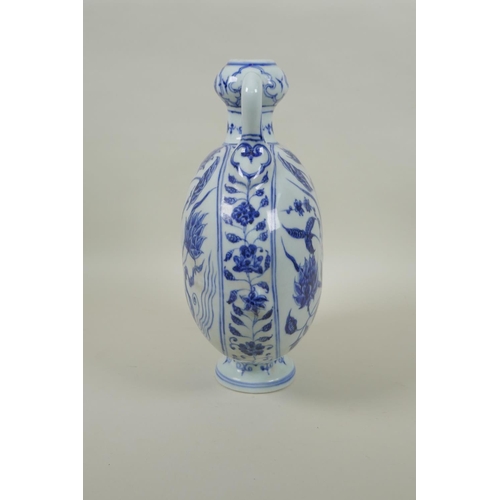 91 - A Chinese blue and white two handled moon flask with lotus flower decoration, 28cm high