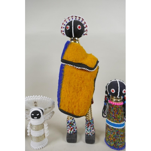 92 - Four South African Ndebele beadwork dolls, largest 37cm high