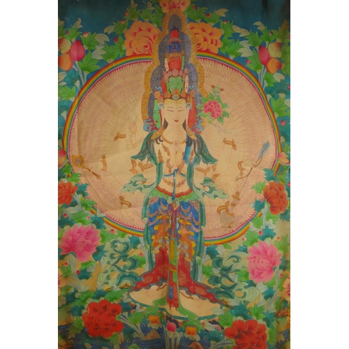 95 - A Tibetan printed thangka within a silk mount, 74 x 106cm