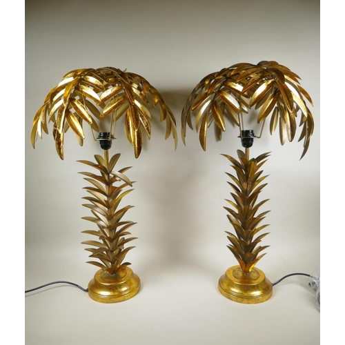 97 - A pair of gilt metal table lamps in the form of palm trees, 72cm high