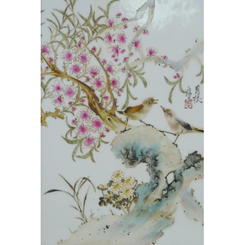 98 - A Chinese polychrome porcelain panel decorated with birds and blossom, in a hardwood frame, 33 x 45c... 