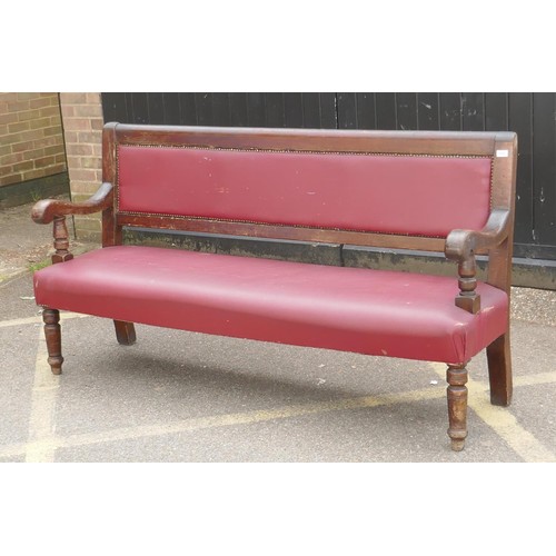 1216 - An antique beechwood bench with leatherette upholstery, 183cm long