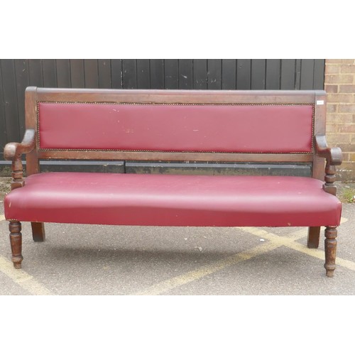 1216 - An antique beechwood bench with leatherette upholstery, 183cm long