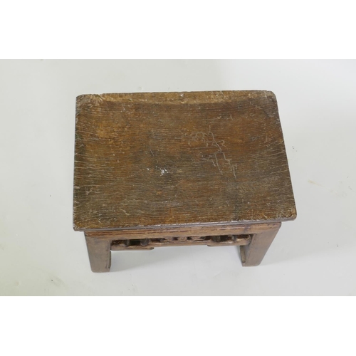 1106 - An early Chinese elm stool with carved frieze, 39 x 28cm, 35cm high