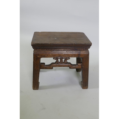 1106 - An early Chinese elm stool with carved frieze, 39 x 28cm, 35cm high