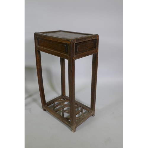 1113 - A Chinese hardwood occasional table with a single drawer and lattice undertier, together with a smal... 