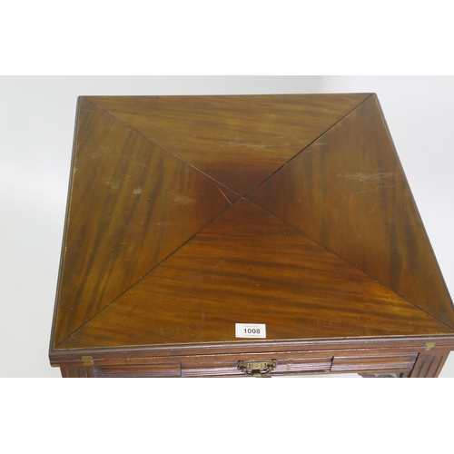 1196 - A Victorian mahogany envelope card table, raised on ring turned fluted supports with scroll ends, th... 