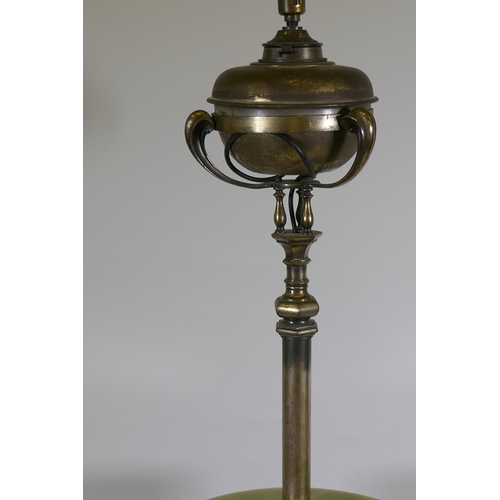 1197 - A silver plated standard/floor lamp, with onyx table, converted from oil to electricity, 168cm high