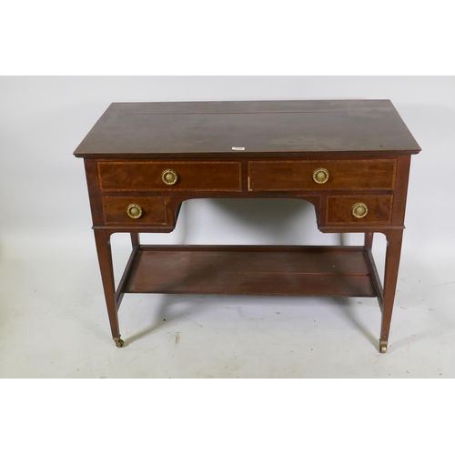 1152 - A late C19th/early C20th inlaid mahogany four drawer kneehole writing/dressing table, raised on tape... 