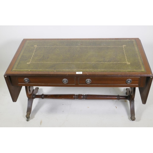 1151 - A mahogany sofa table style drop leaf coffee table, with inset leather top, raised on lyre shaped en... 