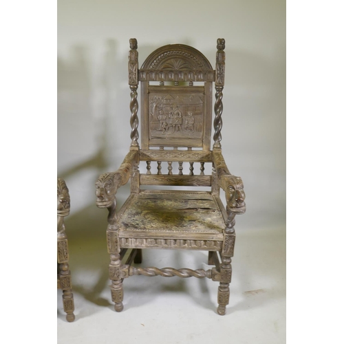 1144 - A pair of antique Continental oak high back hall chairs with carved panel backs and open arms termin... 