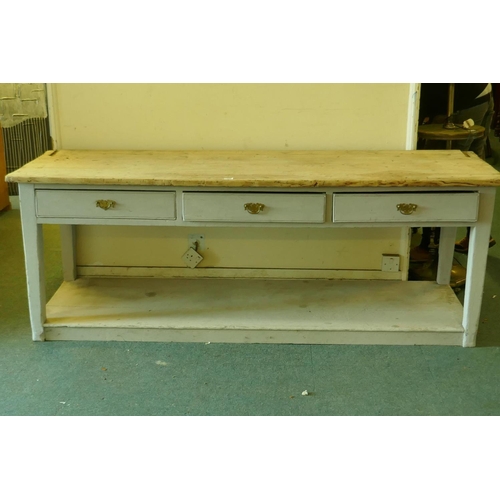 1002 - A C19th pine pot board dresser, scrubbed top over a painted base of three drawers, raised on square ... 