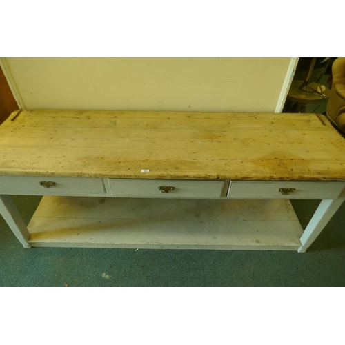 1002 - A C19th pine pot board dresser, scrubbed top over a painted base of three drawers, raised on square ... 