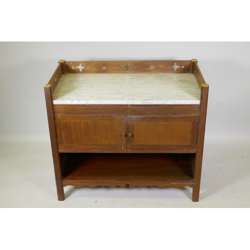 1004 - A C19th mahogany washstand with carrera marble top and three quarter gallery  with gothic style... 