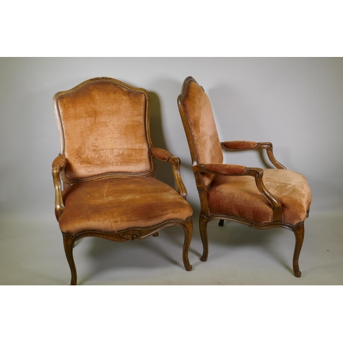 1006 - A pair of beechwood open arm chairs with shaped back in the French style