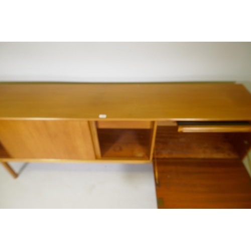 1008 - A McIntosh of Kirkcaldy teak sideboard with slide doors, canteen drawer, fall flap and pull out slid... 