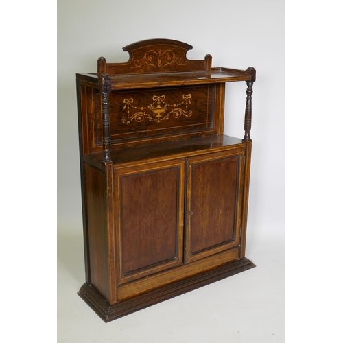 1017 - A Victorian rosewood side cabinet with neo-classical inlaid decoration, an arched back and shelf sup... 