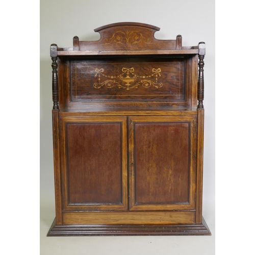 1017 - A Victorian rosewood side cabinet with neo-classical inlaid decoration, an arched back and shelf sup... 