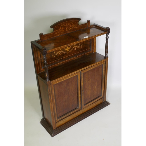 1017 - A Victorian rosewood side cabinet with neo-classical inlaid decoration, an arched back and shelf sup... 