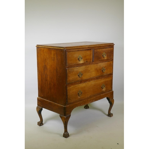 1018 - A Victorian pine chest of two over two drawers with moulded fronts, raised on later cabriole support... 