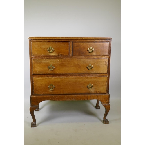 1018 - A Victorian pine chest of two over two drawers with moulded fronts, raised on later cabriole support... 