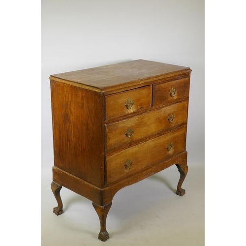 1018 - A Victorian pine chest of two over two drawers with moulded fronts, raised on later cabriole support... 