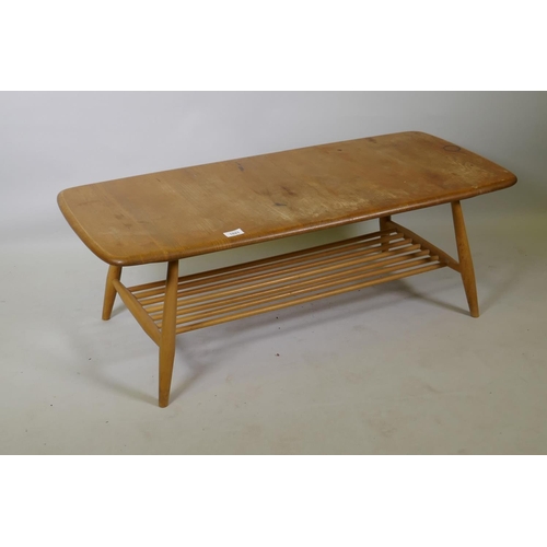 1021 - A mid C20th Ercol elm and beech coffee table, Model 459, 105 x 46cm, 37cm high