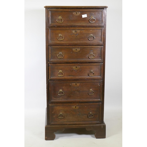 1022 - A C19th oak chest of six drawers with moulded fronts and drop handles, raised on bracket supports, 5... 