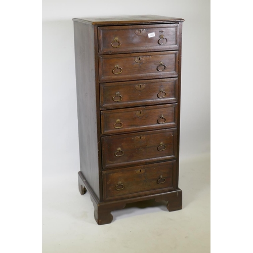 1022 - A C19th oak chest of six drawers with moulded fronts and drop handles, raised on bracket supports, 5... 