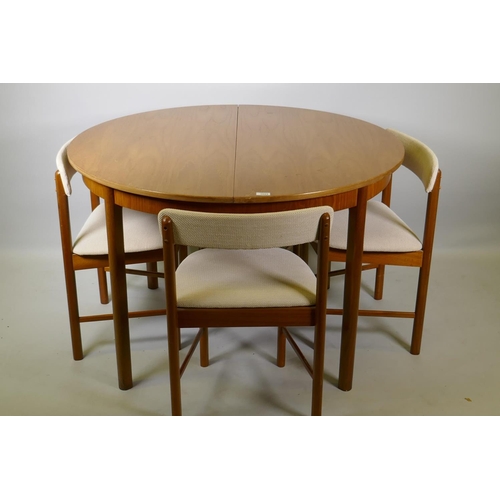 1023 - A McIntosh of Kirkcaldy Roundette teak extending dining table and four chairs ensuite, 114cm diamete... 