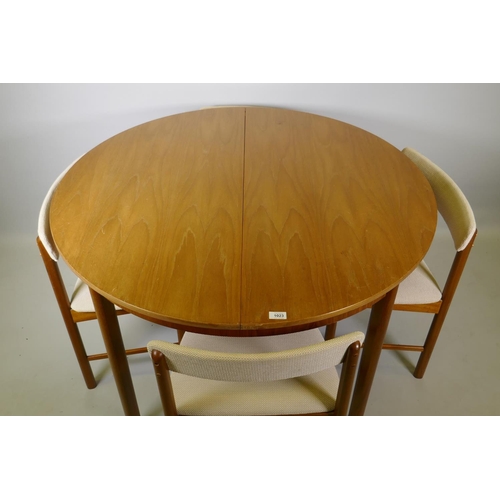 1023 - A McIntosh of Kirkcaldy Roundette teak extending dining table and four chairs ensuite, 114cm diamete... 