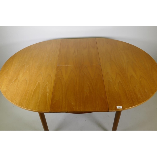 1023 - A McIntosh of Kirkcaldy Roundette teak extending dining table and four chairs ensuite, 114cm diamete... 